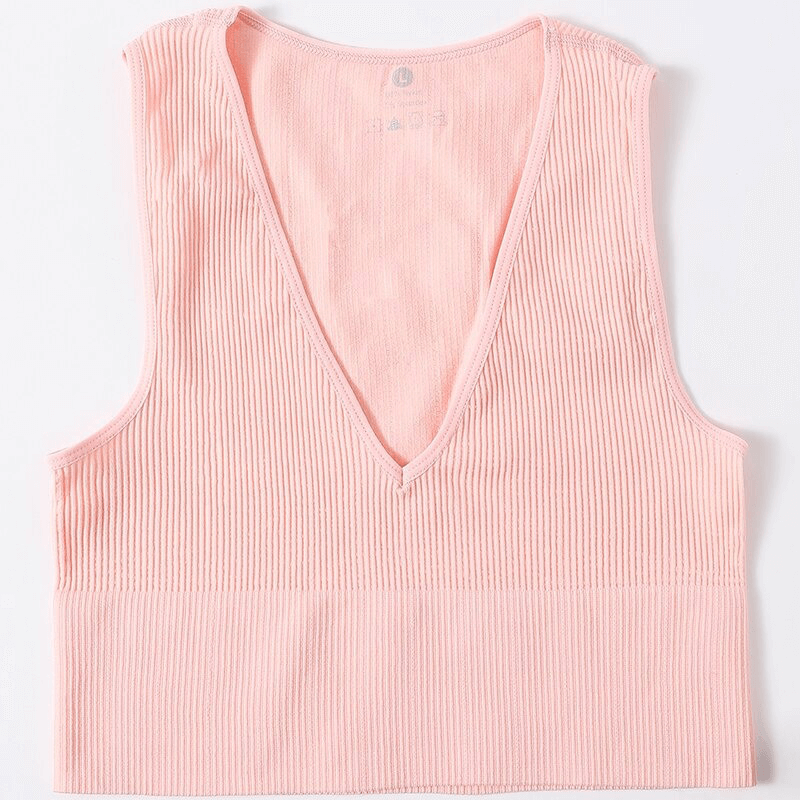 Peach Women's Ribbed Seamless Deep V-neck Tank Top, perfect for yoga and sport. Breathable, stretchy fit. Polyester-spandex blend.